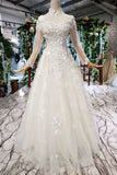 2024 Prom Dresses Tulle High Neck Long Sleeves Handmade Flower Sequins